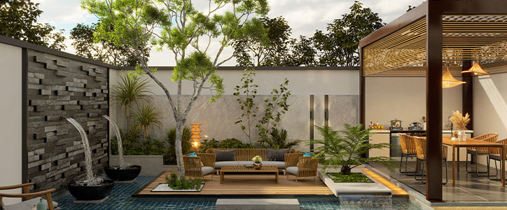 Modern outdoor patio with water fountains, central seating on wooden deck, pergola dining area and lush greenery